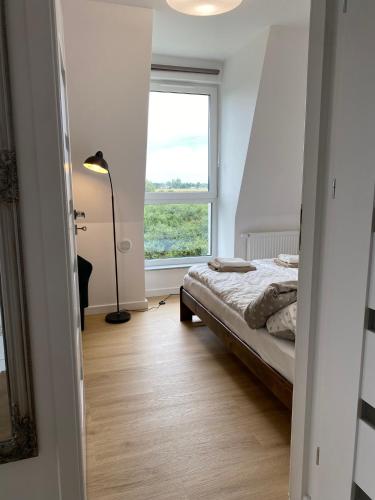 Ένα ή περισσότερα κρεβάτια σε δωμάτιο στο Apartament Zielony Widok