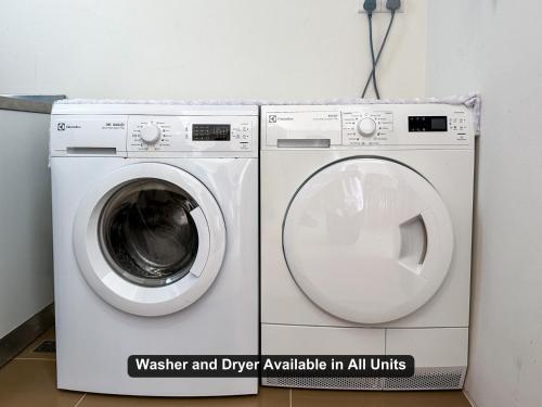 a washing machine and dryer available in all units at By the Sea- Pool and Sea View in Batu Ferringhi