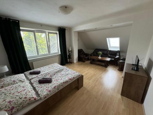 Postel nebo postele na pokoji v ubytování Rodinné apartmány Villa Familia