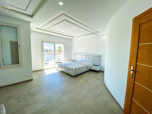 Giường trong phòng chung tại villa Prestige