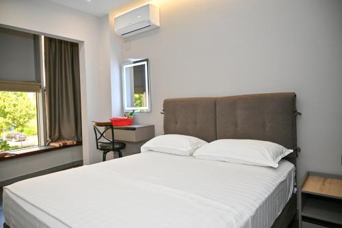 Postel nebo postele na pokoji v ubytování Hotel Vila Emes