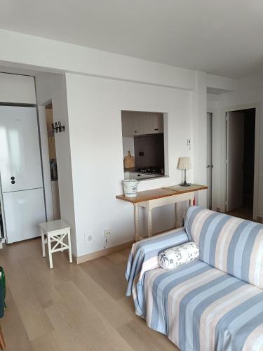 a bedroom with a bed and a table and a desk at FONOLL MARÍ - ROSES FAR in Roses