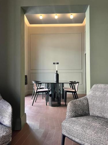 a dining room with a table and chairs at Palazzo Giusti Lecce - Exclusive Boutique hotel in Lecce