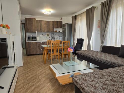 a living room with a couch and a table at Морската Къща in Tsarevo