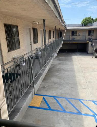 an empty parking lot in front of a building at Hi Rise Motel in Lynwood