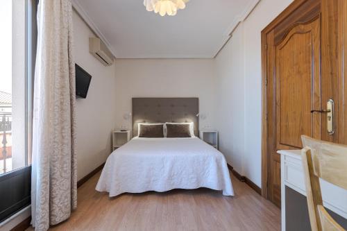 Ένα ή περισσότερα κρεβάτια σε δωμάτιο στο Hotel Eurowest