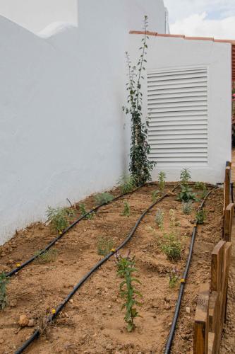 a set of train tracks in the dirt next to a building at Monte do Serrado De Baixo in Évora