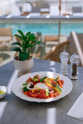 a plate of food on top of a table at ZEST THASSOS LUXURY RETREAT in Limenaria
