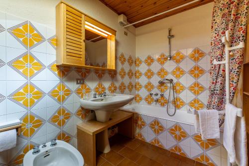 a bathroom with a sink and a mirror at MAISON MOULIN - Relax e vista Montagna - LA THUILE 0107 in La Thuile