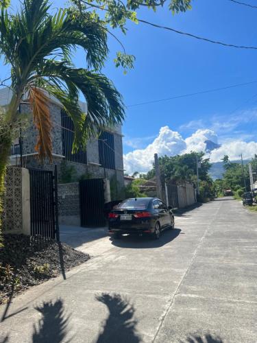 a car parked on the side of a street at Balay na Bato in Legazpi