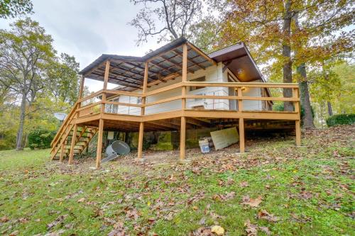 a house is being built in a field at Table Rock Lake Cabin with Deck and Bar! in Shell Knob