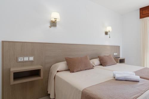 Letto o letti in una camera di Hotel Gaivota