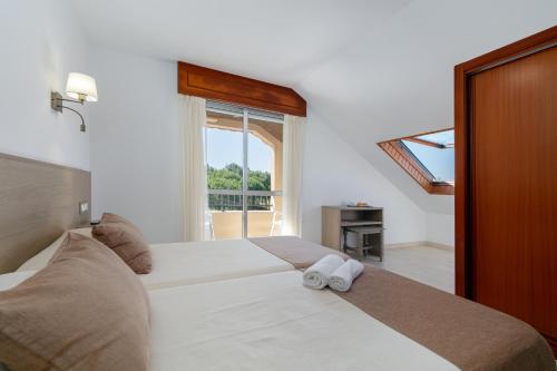 Letto o letti in una camera di Hotel Gaivota