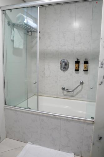 a shower with a glass door in a bathroom at Hotel Nacional Inn Jaragua Sao Paulo in Sao Paulo