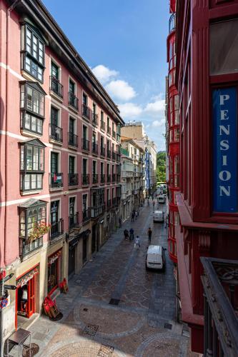 a view of a city street with buildings at Casual Fuentes in Bilbao