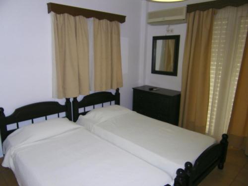 A bed or beds in a room at Hotel Filioppi