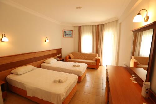 Postel nebo postele na pokoji v ubytování Mavruka Hotel