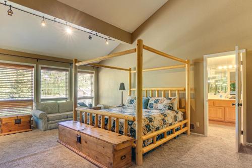 ein Schlafzimmer mit einem Bett mit Holzrahmen in der Unterkunft Spacious Brian Head Mtn Getaway with Hot Tub! in Brian Head