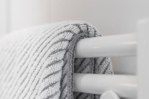 a close up of a white blanket on a bed at Apart Schneider in Ischgl
