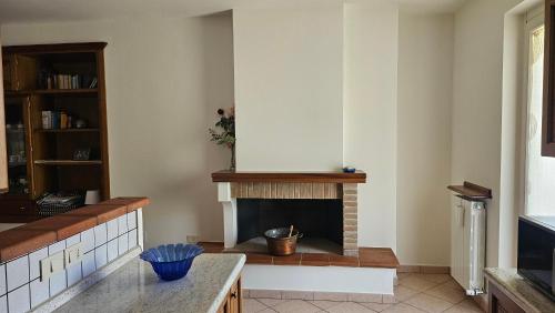a living room with a fireplace in the corner at Pane e Cioccolata in Foligno