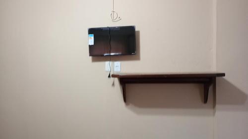 a room with a wall with a shelf on a wall at Pousada Preludio in Conservatória