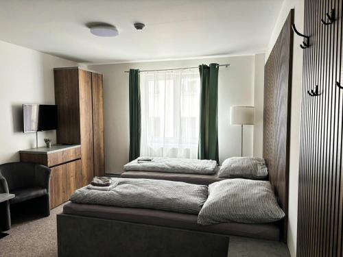 Postel nebo postele na pokoji v ubytování Apartmány Plzeň Zborovská 22 a