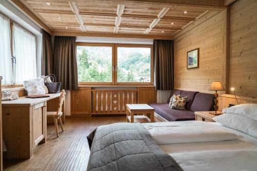 Postel nebo postele na pokoji v ubytování Hotel Arnaria