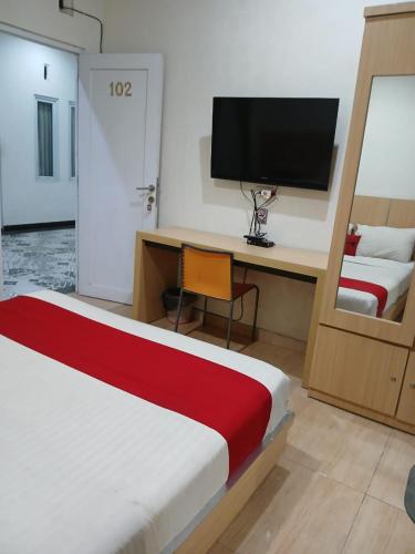 Una cama o camas en una habitación de Macan Kumbang Residence