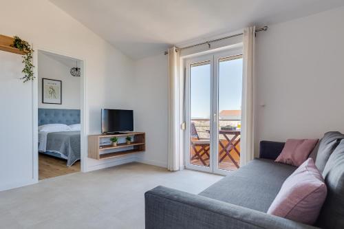 TV a/nebo společenská místnost v ubytování Apartments Bonex