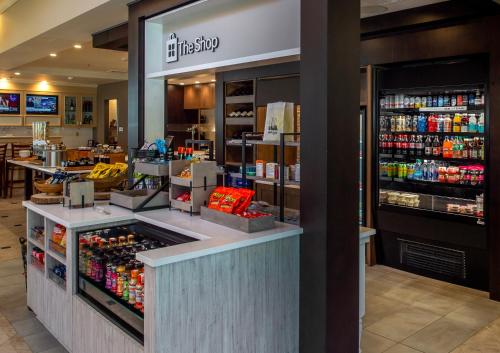 a store with a counter with a lot of drinks at Hilton Garden Inn St. Louis/Chesterfield in Chesterfield