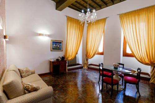 a living room with a couch and a table at Residenza Carlandi Tivoli in Tivoli