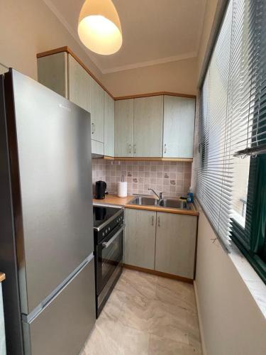 Η κουζίνα ή μικρή κουζίνα στο Maria's central apartment