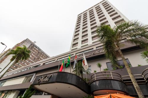 a building with flags in front of it at Parque Balneário Hotel Santos by Castelo Itaipava in Santos