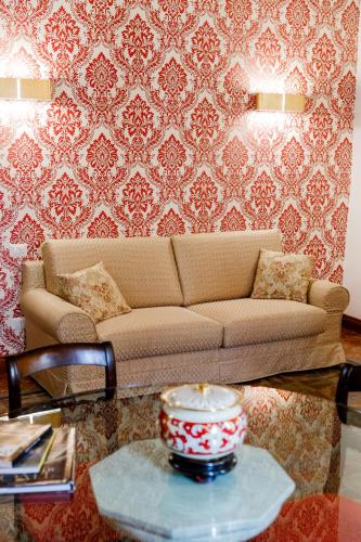 a living room with a couch and a table at Residenza Carlandi Tivoli in Tivoli