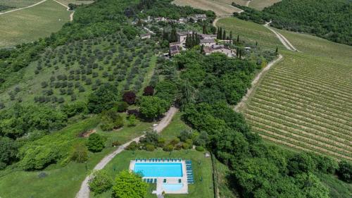an aerial view of a estate with a swimming pool on a hill at Bella Vista in Gaiole in Chianti