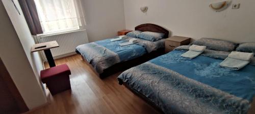 Postel nebo postele na pokoji v ubytování Vila Ivanović