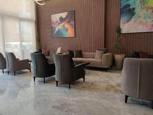 a waiting room with couches and chairs in a building at Executive Boutique Hotel Rabat in Rabat