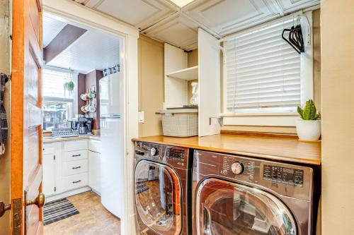 a laundry room with a washer and dryer at Deck and Fire Pit Manitou Mountain Retreat in Manitou Springs