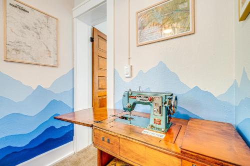 a sewing machine sitting on top of a wooden desk at Deck and Fire Pit Manitou Mountain Retreat in Manitou Springs