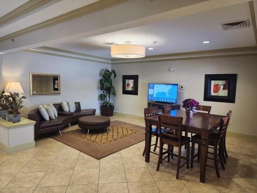 a living room with a table and a couch at Candlewood Suites Springfield by IHG in Springfield