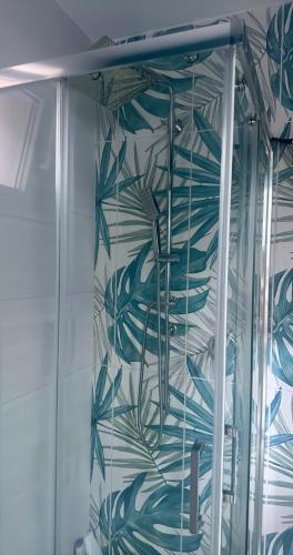 a shower with a blue and white wall at Casa Vacanze Aurelia in Procida