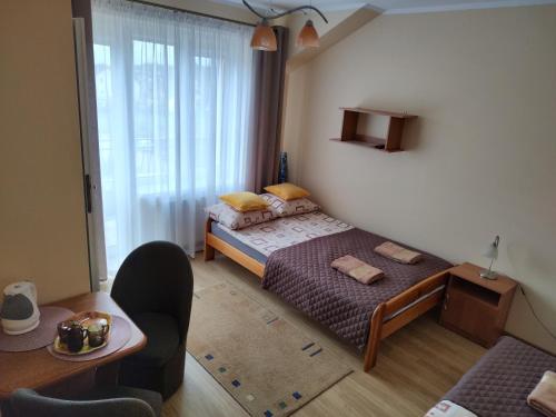 Postel nebo postele na pokoji v ubytování Pokoje Goscinne Bartosz