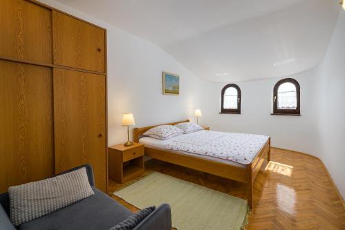 Postel nebo postele na pokoji v ubytování Apartments Tena