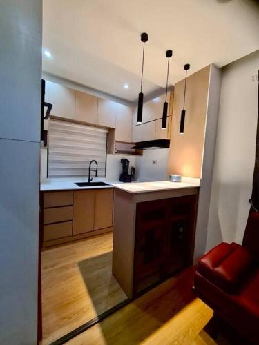 a kitchen with a sink and a counter top at Luxury self-contained Studio Apt at Ikoyi, Lagos in Lagos