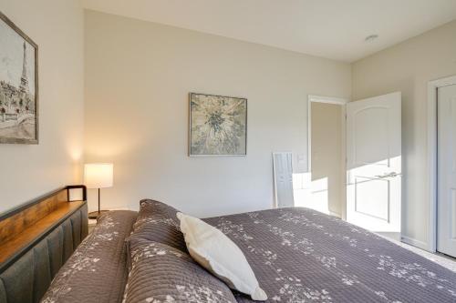 a bedroom with a bed and a large window at Mankato Getaway with Game Room and Salt Water Hot Tub! in Mankato