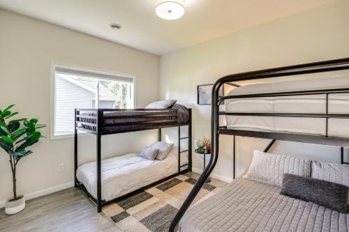 a bedroom with two bunk beds and a window at Mankato Getaway with Game Room and Salt Water Hot Tub! in Mankato