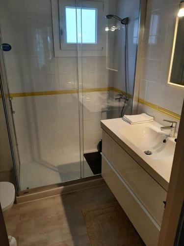 a bathroom with a shower and a sink and a toilet at Son Parc - Albatros in Son Parc
