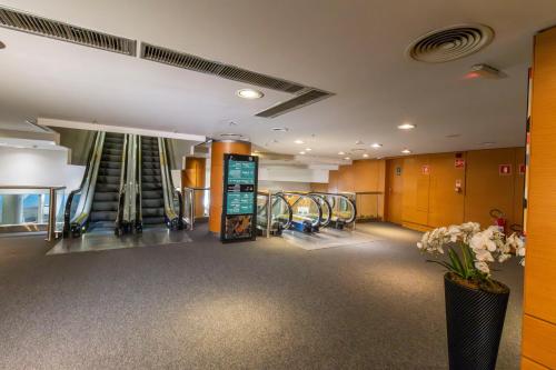a gym with treadmills and machines in a building at Hotel Nacional Inn Jaragua Sao Paulo in Sao Paulo
