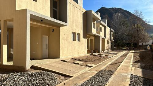 a building under construction with a mountain in the background at Cabañas Balcón del Famatina in Chilecito
