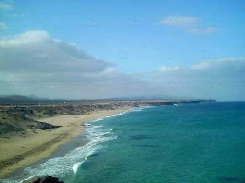 an aerial view of a beach and the ocean at descanso en espacio natural con vistasTharada in El Roque